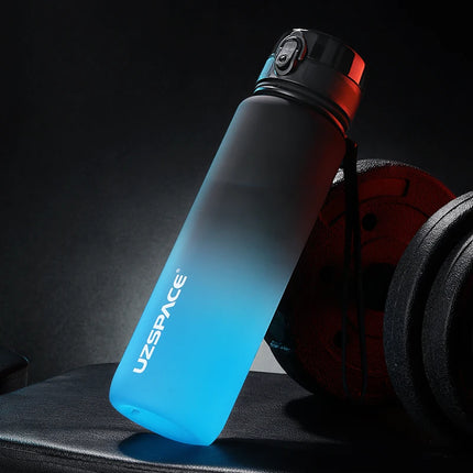 Gradient blue to black water bottle with 'UZSPACE' branding on a dark background