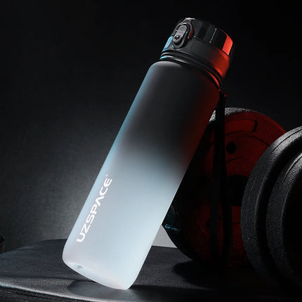 Gradient water bottle with 'UZSPACE' branding on a dark background